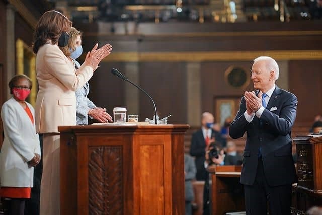 President Joe Biden, Vice President Kamala Harris, and Speaker of the House Nancy Pelosi celebrate the delivery of the Joint Address in the House Chamber on April 28, 2021.